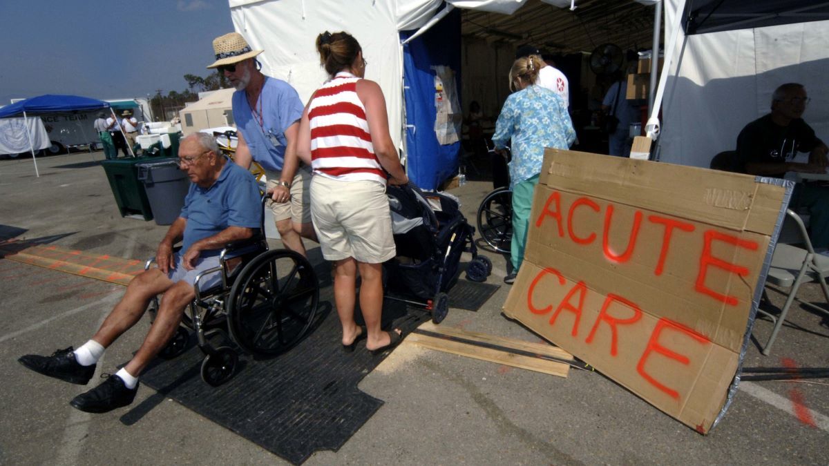 Victims of Hurricane Katrina find help at the North Carolina MED 1 mobile hospital set up in a Walmart parking lot along U.S. 90 on September 14, 2005 in Waveland, Mississippi.