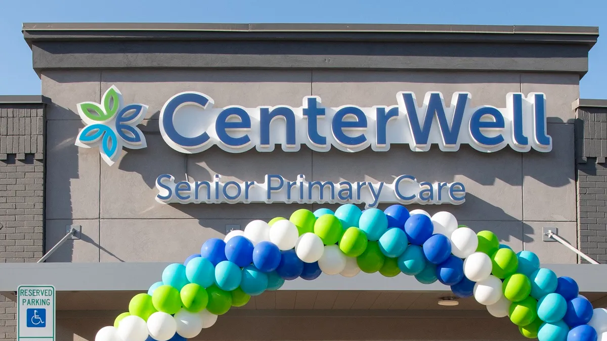 The blue and green Centerwell Senior Primary Care logo is seen on a clinic's facade.