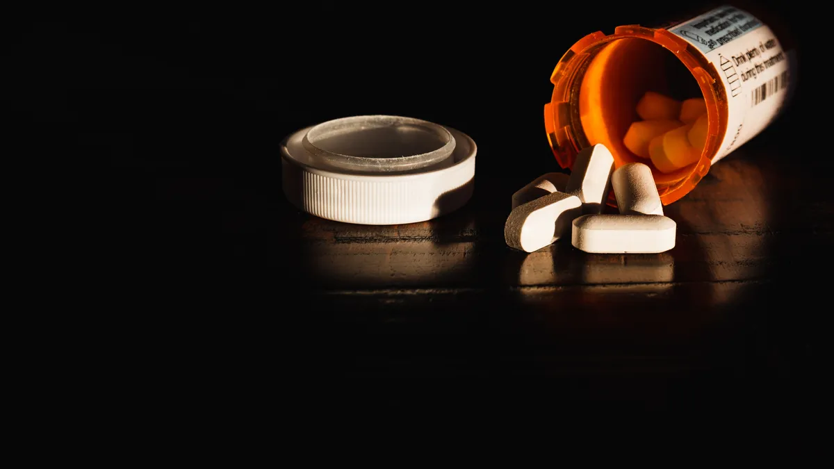 A picture of an overturned prescription pill bottle.