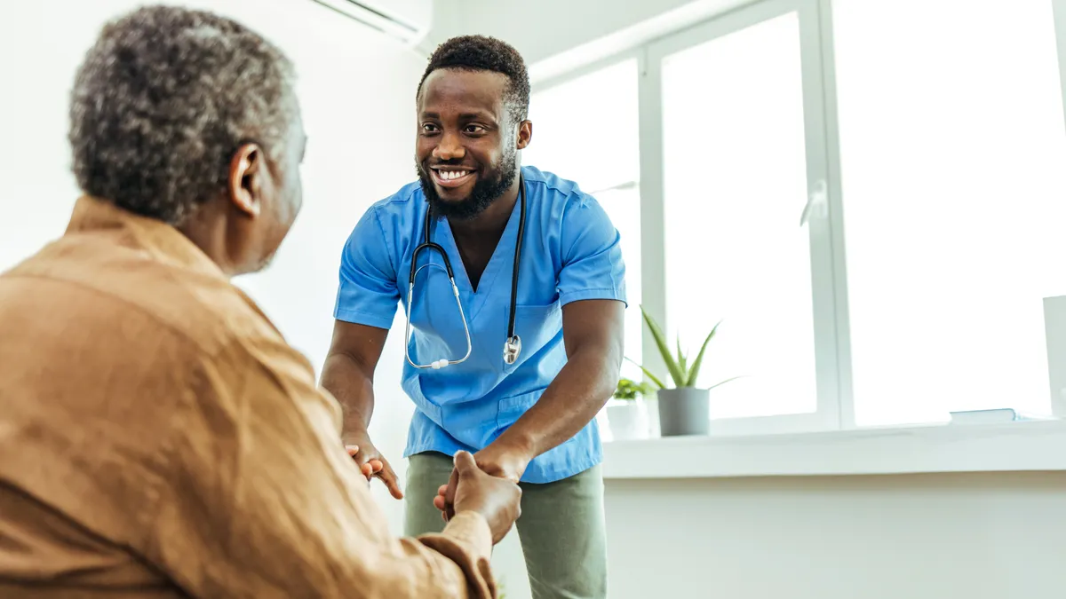 Nurse sees elder patient in nursing home