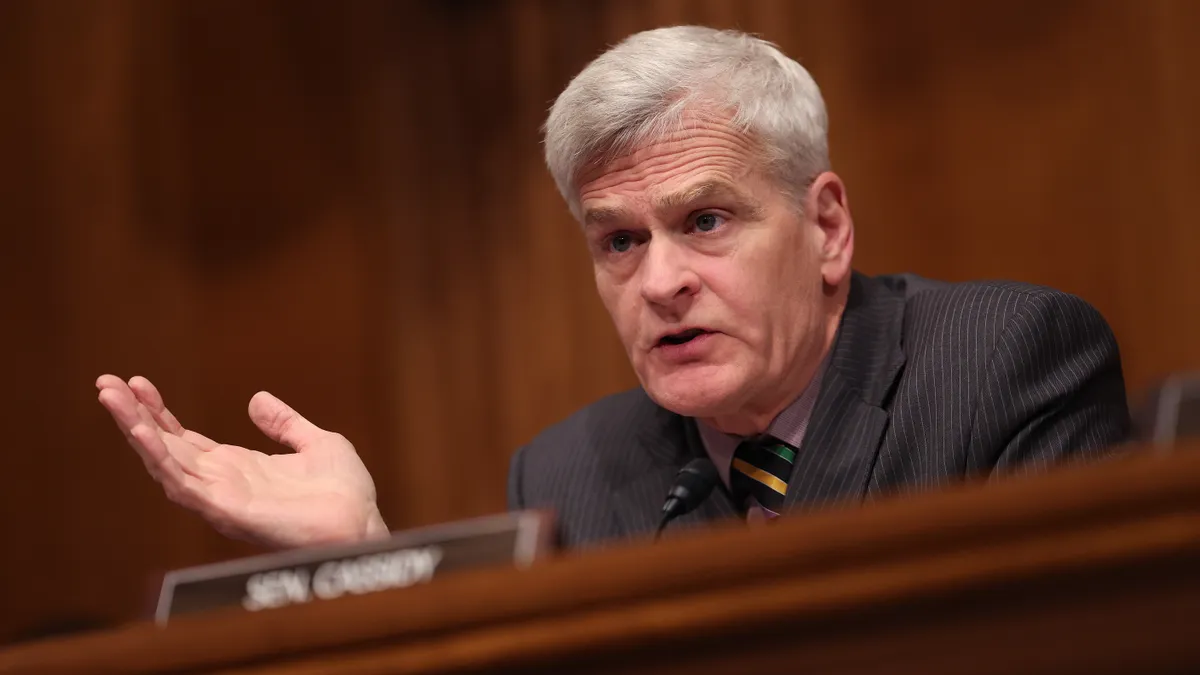 A picture of senator bill cassidy at a senate committee hearing, raising his right hand.