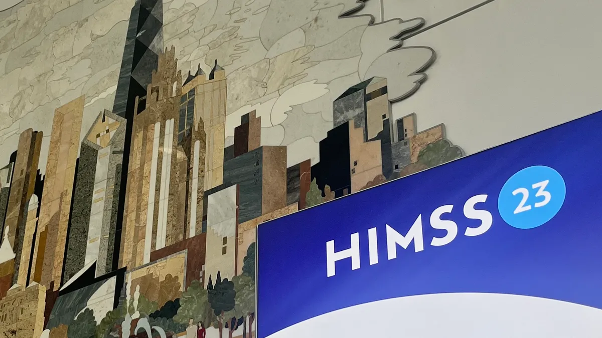 The HIMSS logo in front of a tiled mural of Chicago.